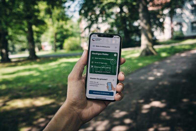 Corona Tracing App Opened While Holding Smartphone In A Park Editorial 
